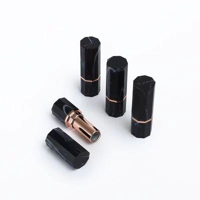 Luxe zwarte marmeren patroon achthoekige lippenstift tube container met roségouden accent